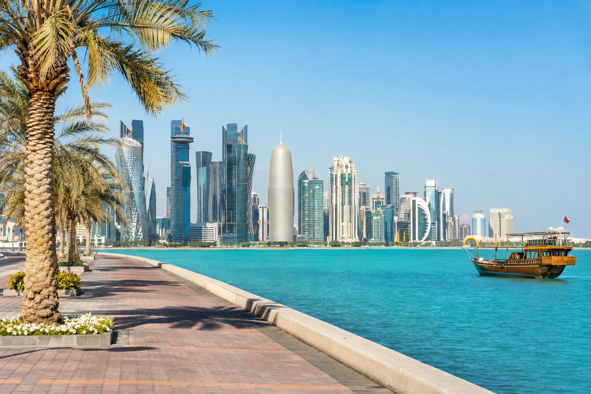 Doha waterfront and West Bay skyline beside turquoise water