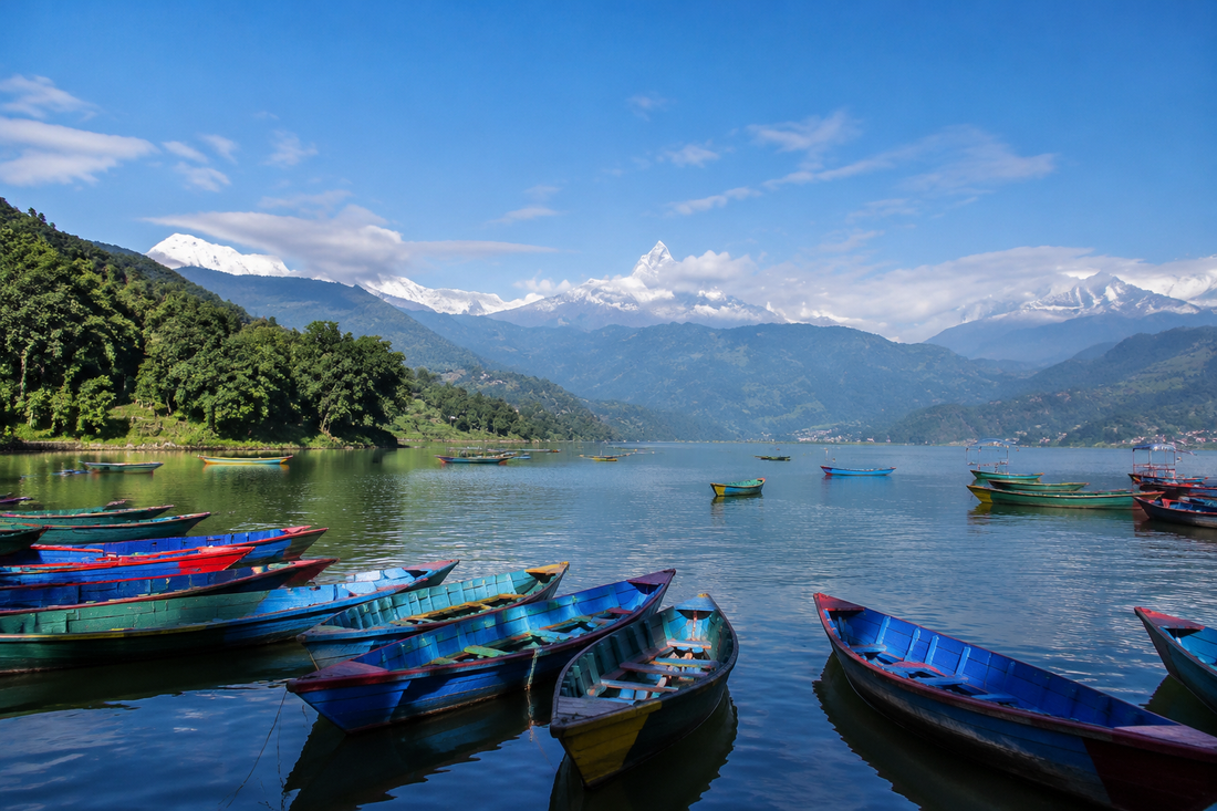 Illustrative Phewa Lake scene with boats and distant mountains