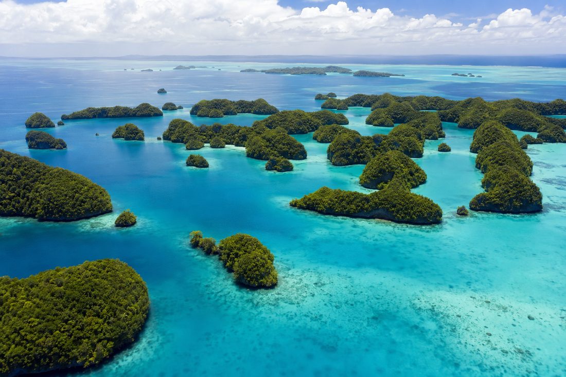 Illustrative aerial view of Palau's green Rock Islands and turquoise lagoon