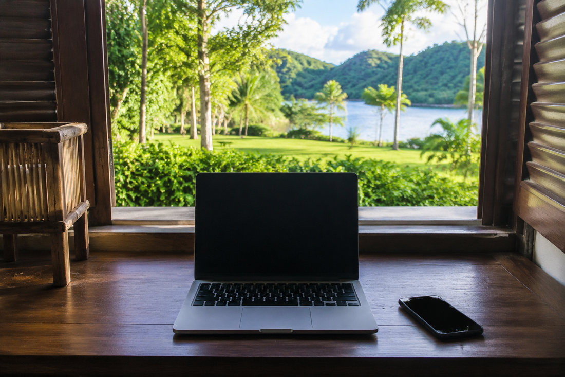 Unbranded phone and laptop in a bright Palau-inspired guesthouse